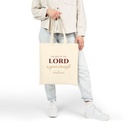 Joy of the Lord Christian canvas tote bag held by hand